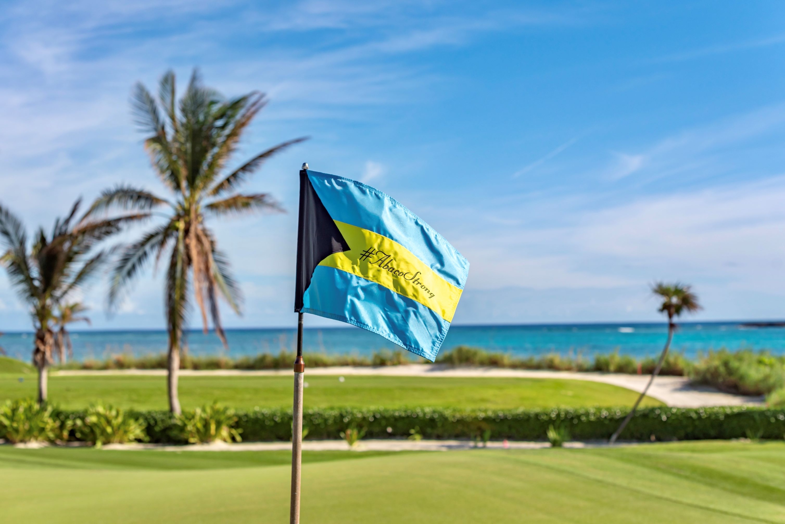 Bahamas flag image with a hashtag from The Abaco Club
